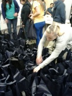 Avisor Kristin Bowyer is putting extra food on the bags. Only the lucky bags got extra food.
