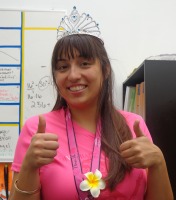 Damaris Pereda poses with her crown, shirt, and medal. These are from the Diva Run 5K.
