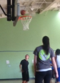 A team at the tournament is shooting a basket. They tried their hardest for the ball to go in but sadly, they didnt.