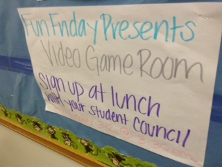 This is a poster to promote Fun Friday. It advertises that there was a video game room at the event.