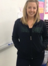 English teacher Kristin Bowyer is wearing her college sweater. She wore it for College Day (a day were college visitors came in to talk to students about college), which was a day before  College Gear Spirit Day.