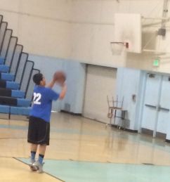 Basketball player shooting some hoops.