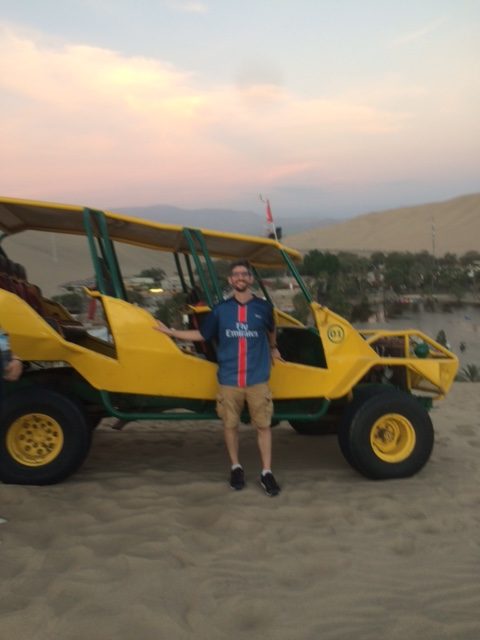 Teacher Carl Finer in Hunacaina, Peru after an afternoon riding dune buggies and sandboarding