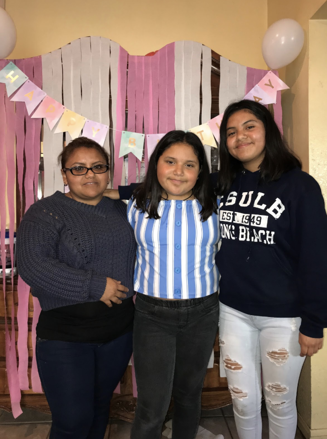 Xitlacly Ibanez celebrating her twelfth birthday with, her mother and older sister Litzy (missing from family photo is her baby sister)
