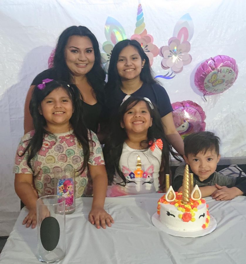 My family celebrating my little sisters birthday, my mom still celebrated even though it was late and she came from work.