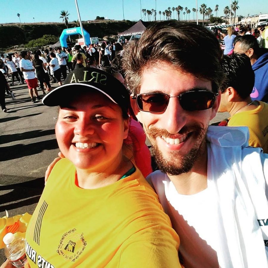 Teachers+and+Students+Run+LA+coaches+Carl+Finer+and+Lorena+Iglesias+at+the+finish+of+the+SRLA+5k+at+Dockweiler+Beach+in+2017.
