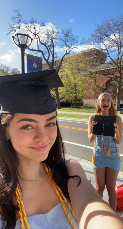 In this photo Angelia Brede just graduated and took this picture with her friend.