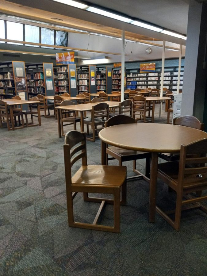 At the library, there is so many empty tables and chairs. The library used to be full of people reading or working on something. Less people visit places outside due to Covid.