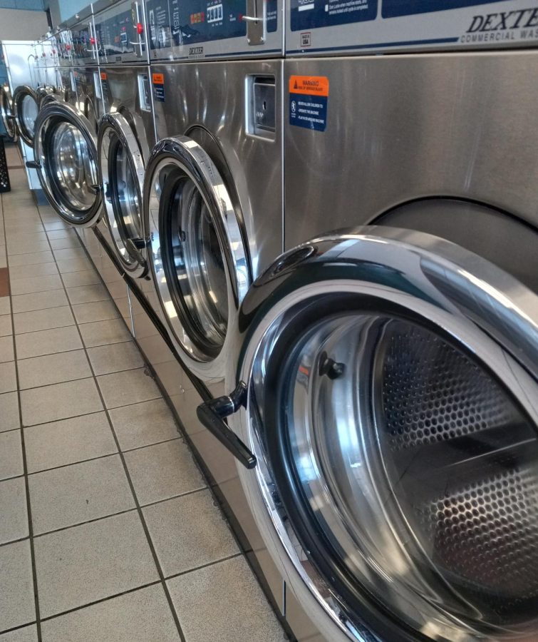 At the laundry, there are many empty washing machines. Less people are going places, such as the laundry. Covid has affected the amount of people going outside and where they go.