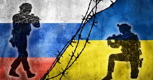 This image shows two soldiers separated by barbed wire indicating that these two are on separate sides going against each other. One side represents Russia and the other represents Ukraine.