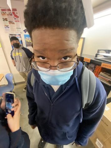 Student Jacob Milton wearing a mask in class.