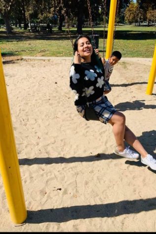 Maria having fun on a swing.  