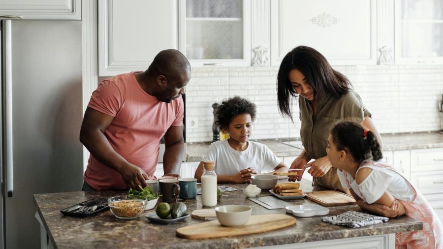 A family cooking breakfast together.