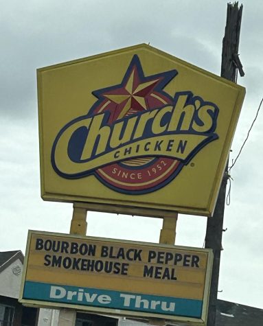 The restaurant sign of Churchs Chicken.