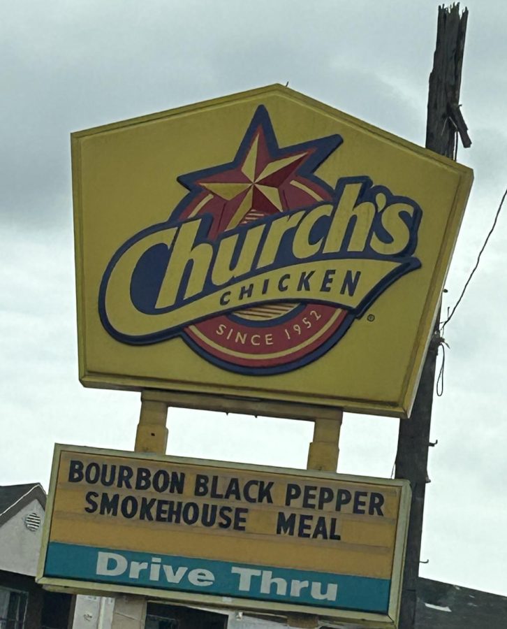 The restaurant sign of Church's Chicken.