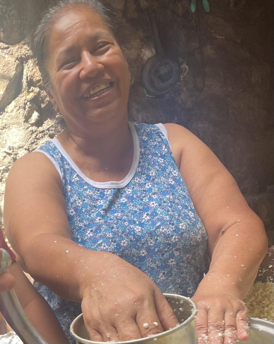 Columba Adame grinding corn to make so the we could eat.