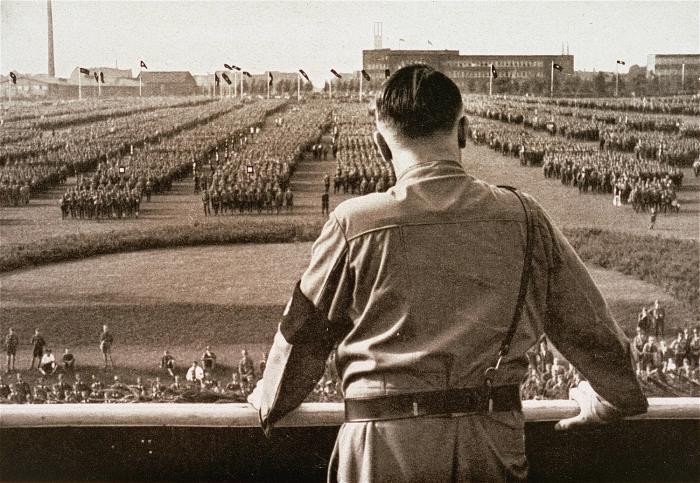 Hitler leading German Nazis .