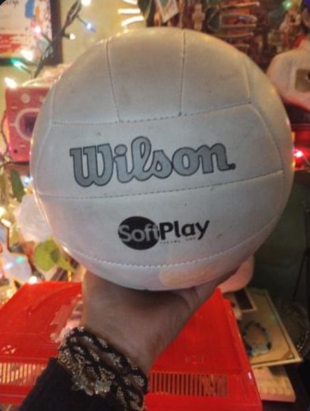 Kimberly getting a volleyball for Christmas.