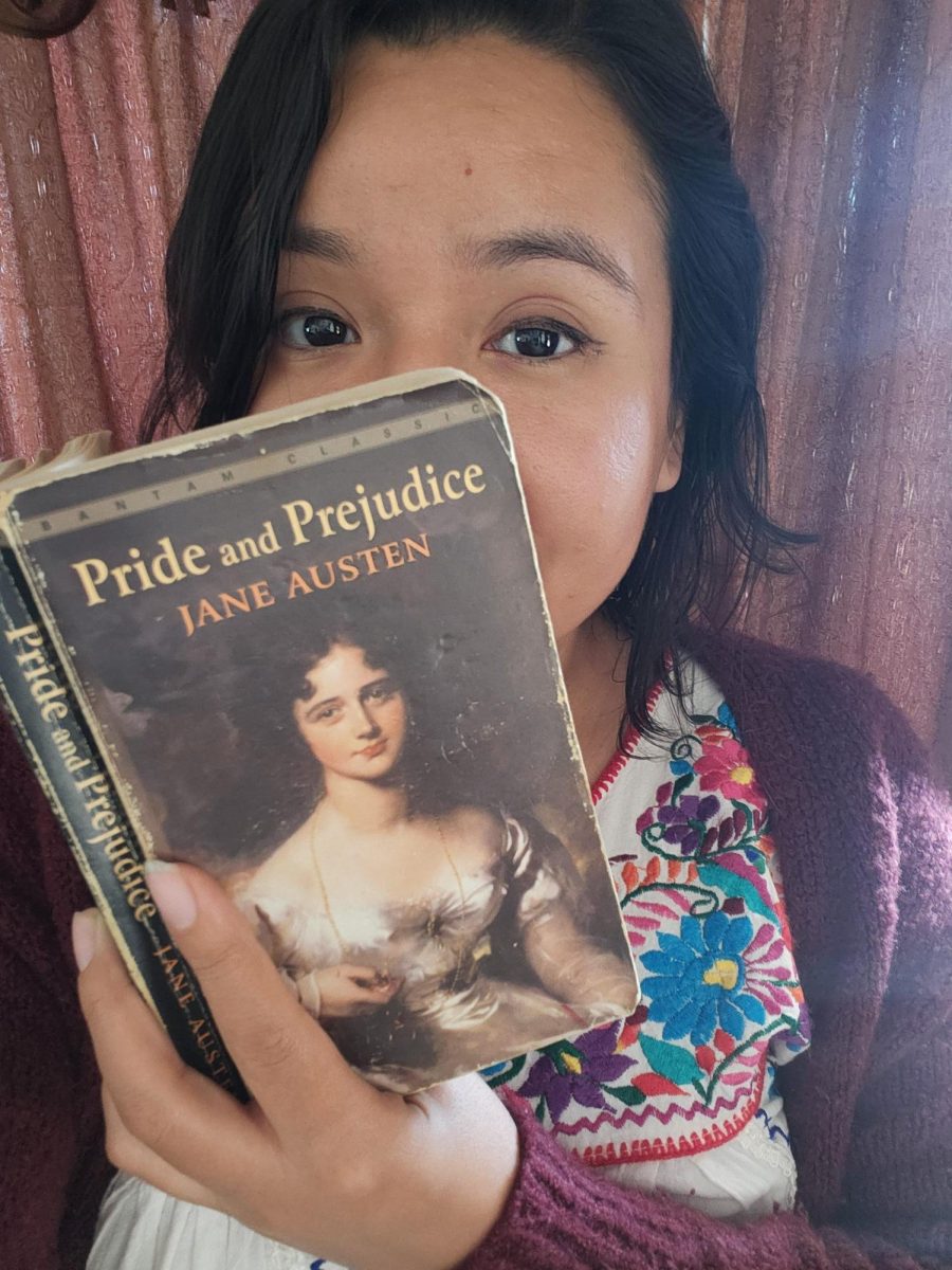 Ms.Briseno with her favorite book, Pride and Prejudice.