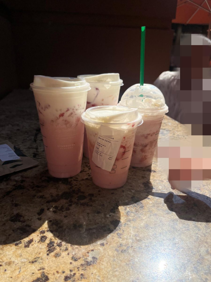 My sisters and I with our Starbucks drinks.