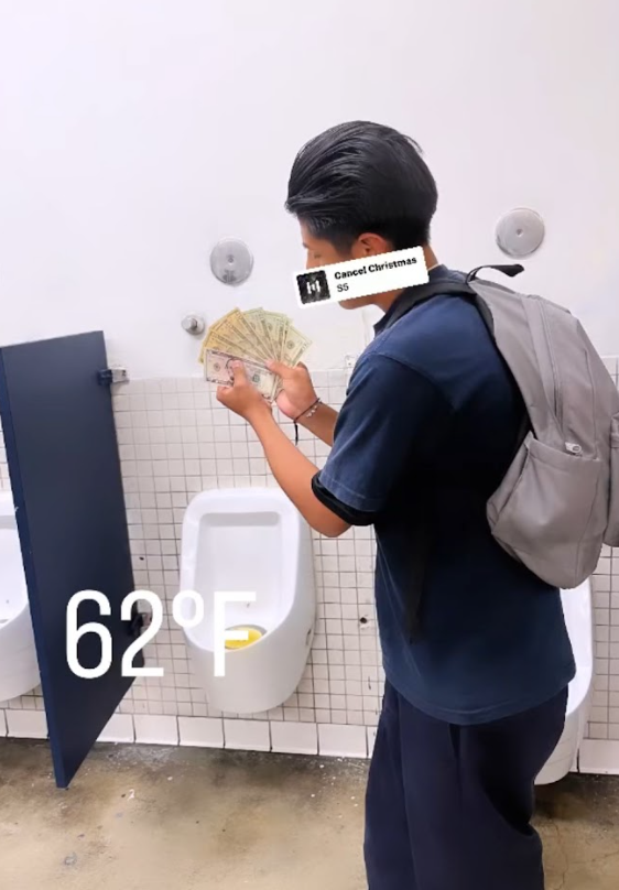 Manuel flexing his money in the restroom.