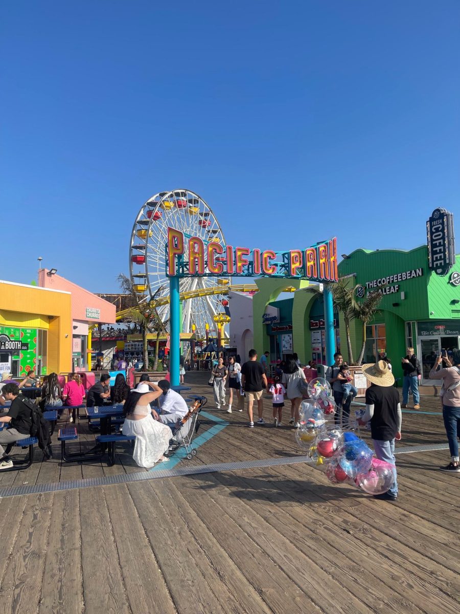 This is the colorful entrance to the Santa Monica Pier rides and shops where a lot of people gather.