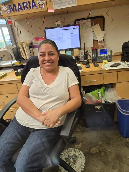 Ms. Zavala working at the front desk