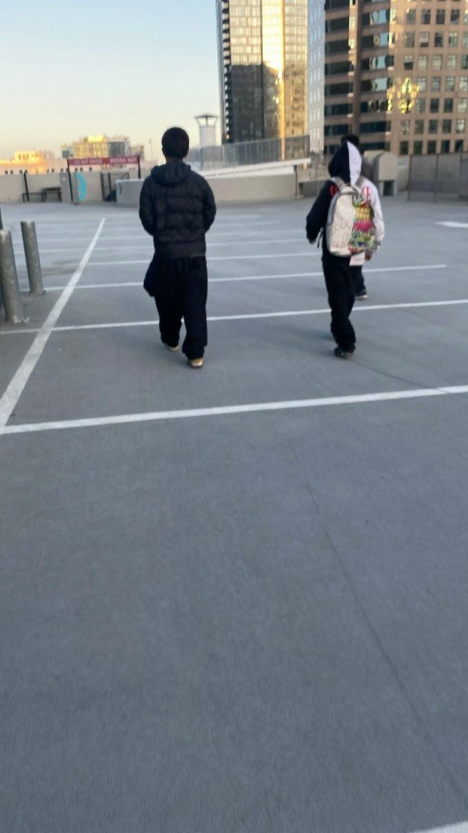 Angel with his friend walking together after going somewhere.