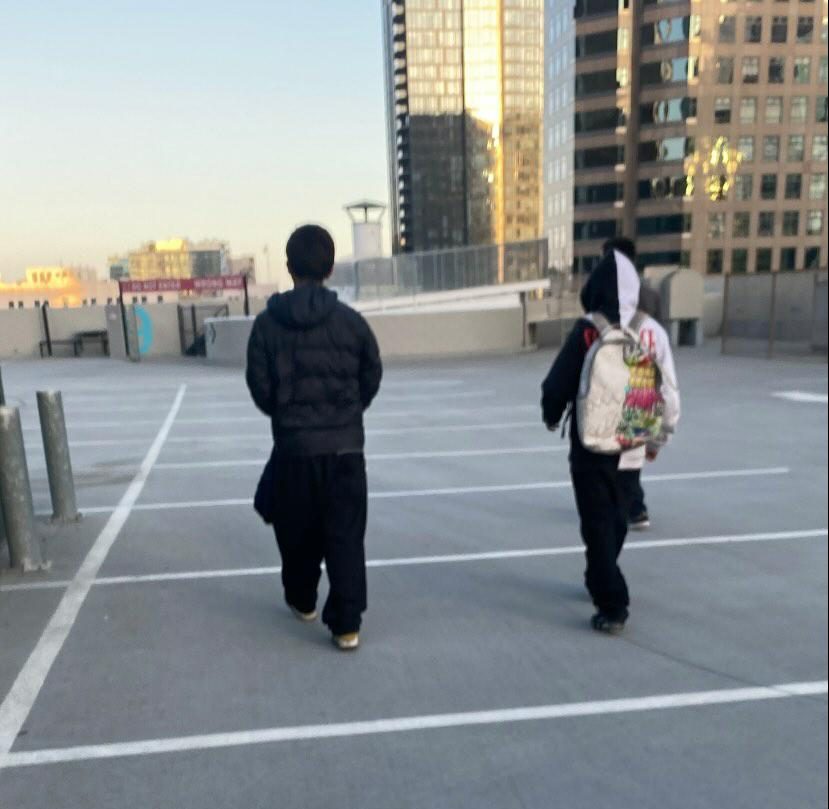 Angel with his friend walking together after going somewhere.