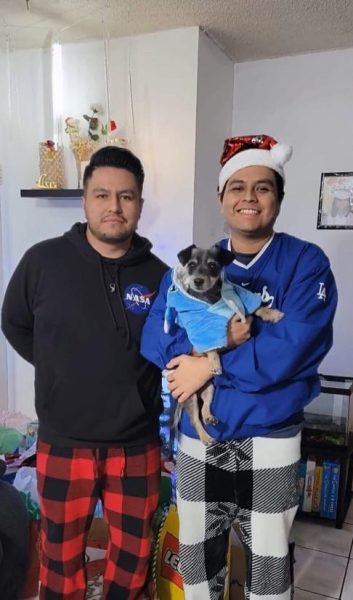 Brandon (left) and Yoshua (right) holding Muffin. 