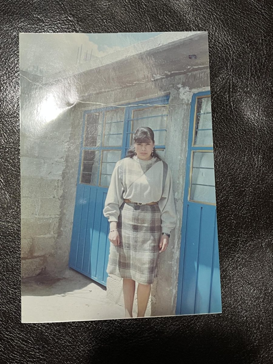 Francisca in front of her childhood home. 