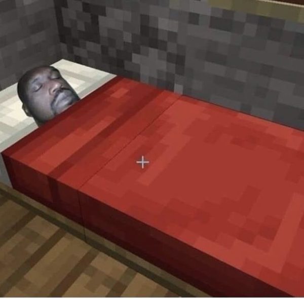 Shaquille O'Neal sleeping on a Minecraft bed. 