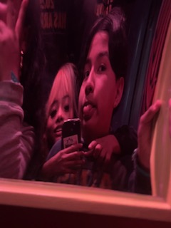 Ashley taking a picture of her and Kenneth at Universal Studios.