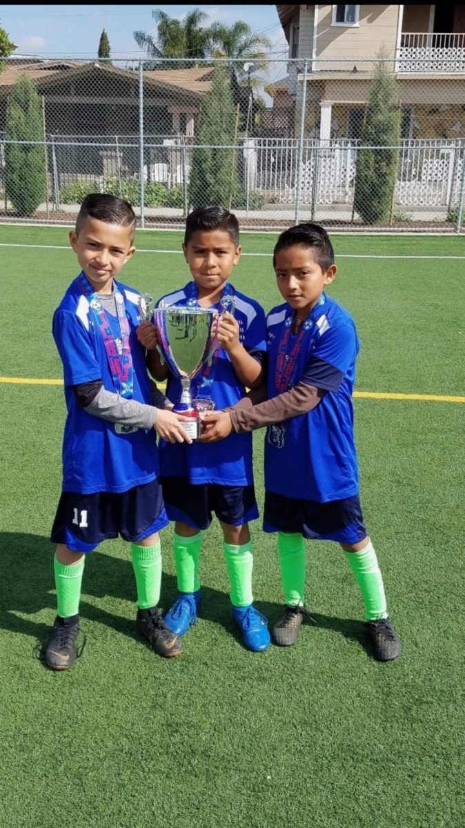 Felipe winning his first soccer trophy 