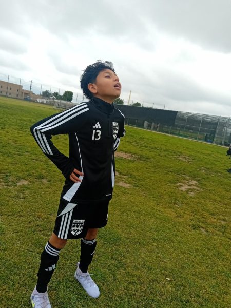 My brother posing for the camera in the middle of the field!