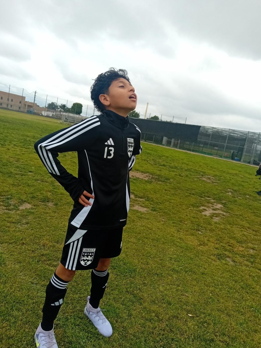 My brother posing for the camera in the middle of the field!