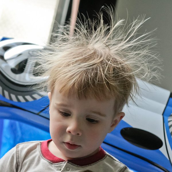 Little boy having static hair.