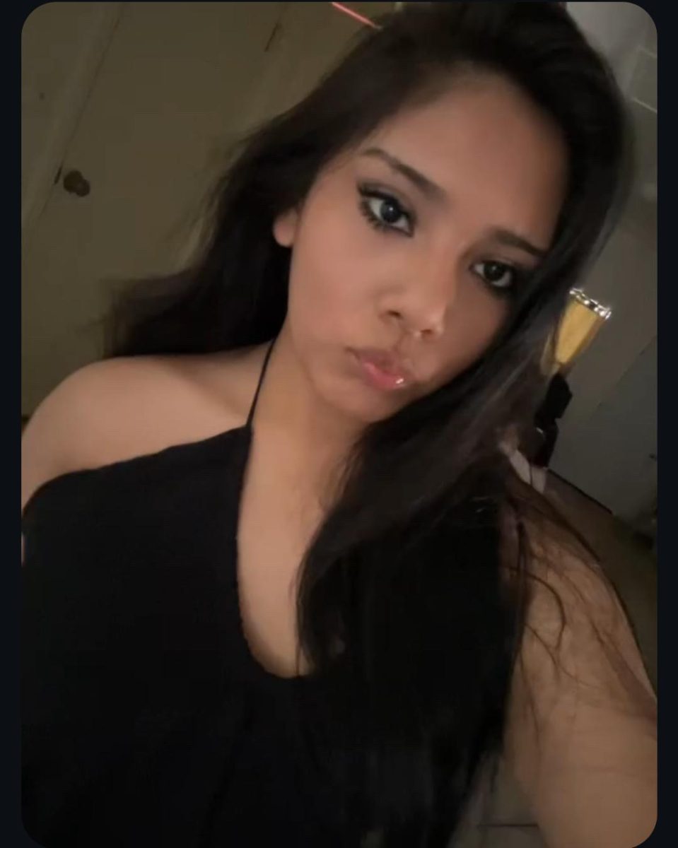 Kaily taking a picture before going out.