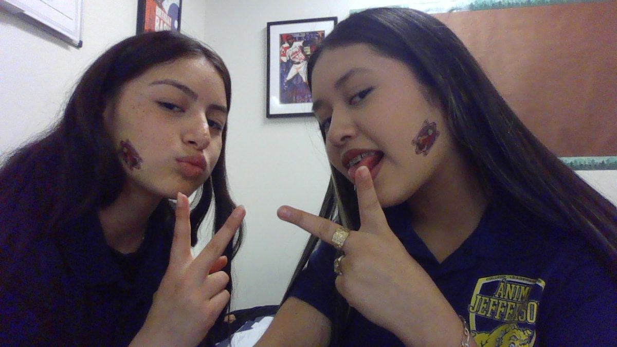 Kayla and her friend candy taking a picture .