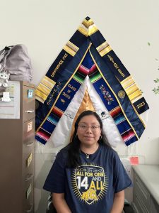 Ms. Ronquillo at her desk working.
