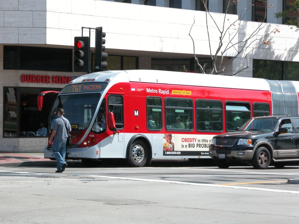 A metro bus stopping at a station