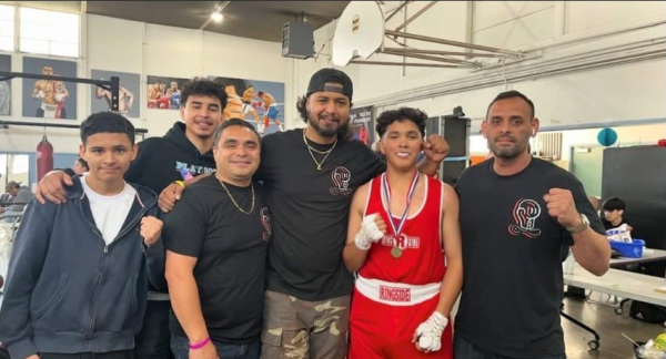 A team photo after winning an amateur boxing event.