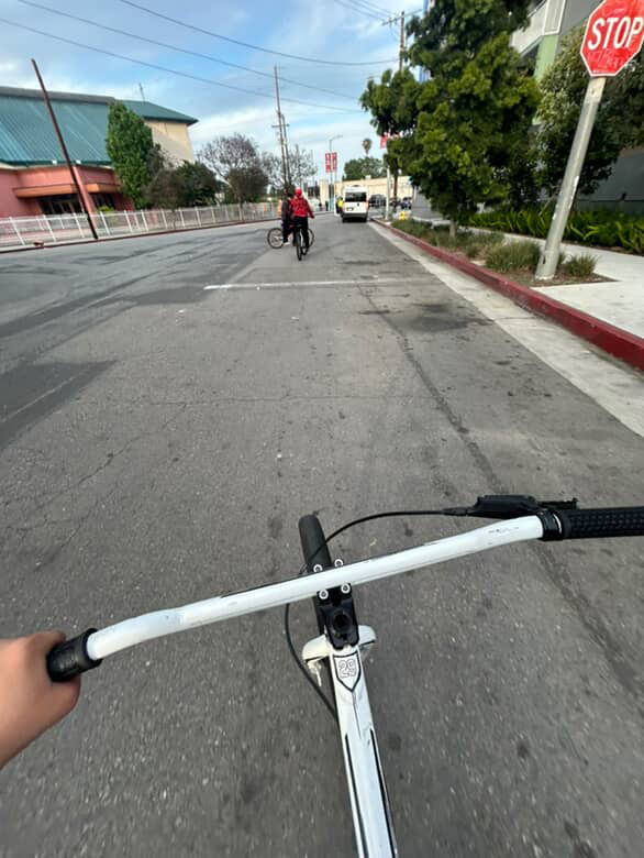 Alan riding his bike with his friends.