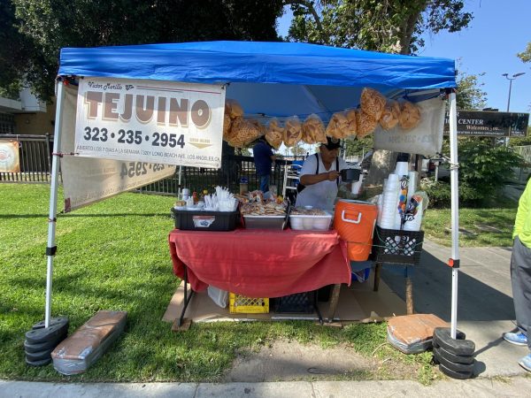 Victor serving a sample of tejuino. 