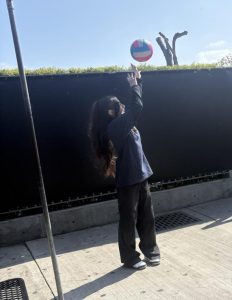 Kayla playing volleyball.