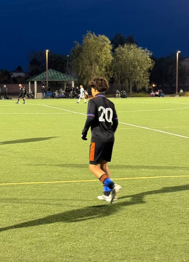 Jacob plays soccer during one of his soccer games.  His team won the game.