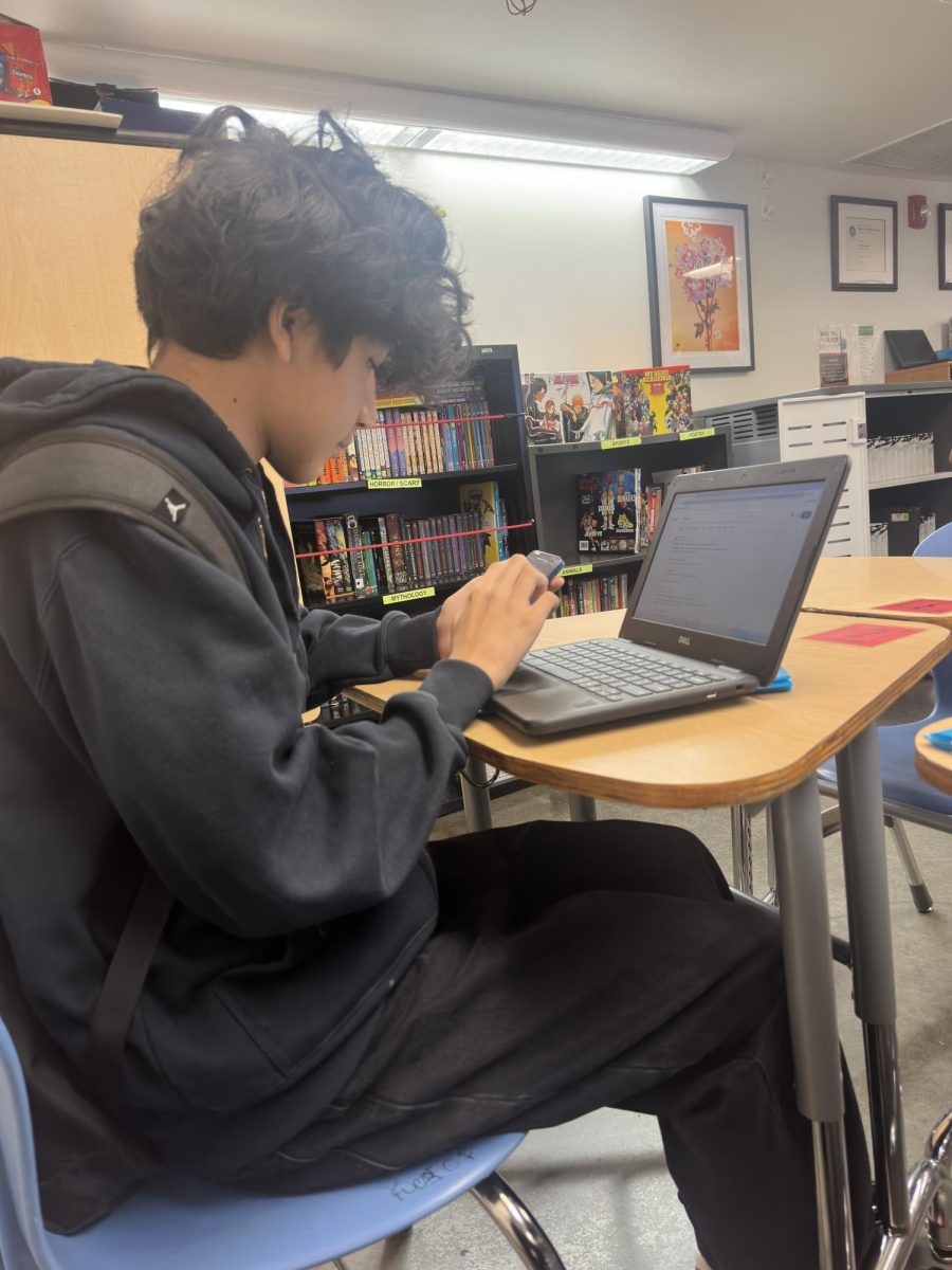 Joseph does his Bulldog Bugle  assignment in fourth period.