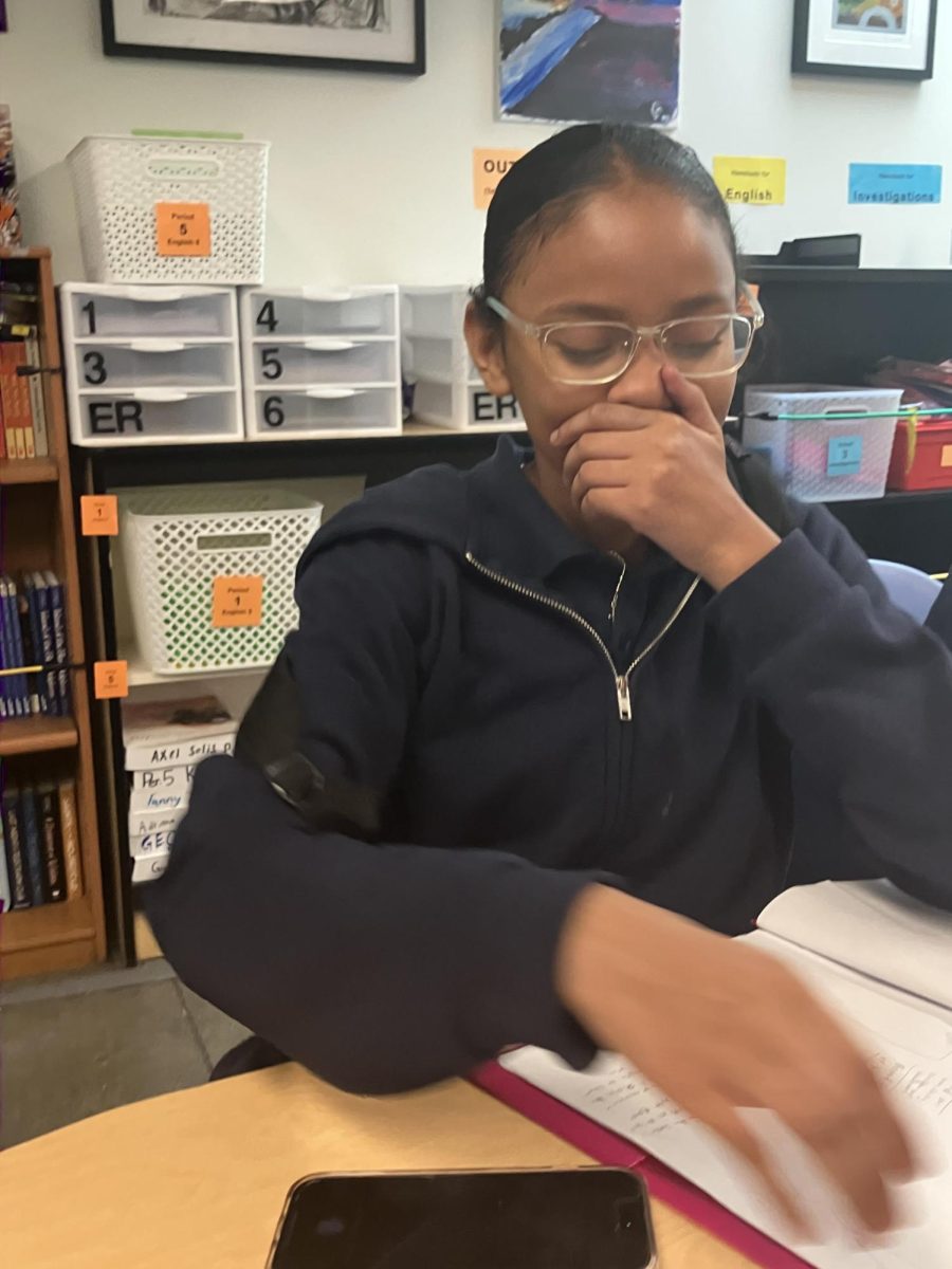 Janelle works on the do now in Mr. Finer's class. 