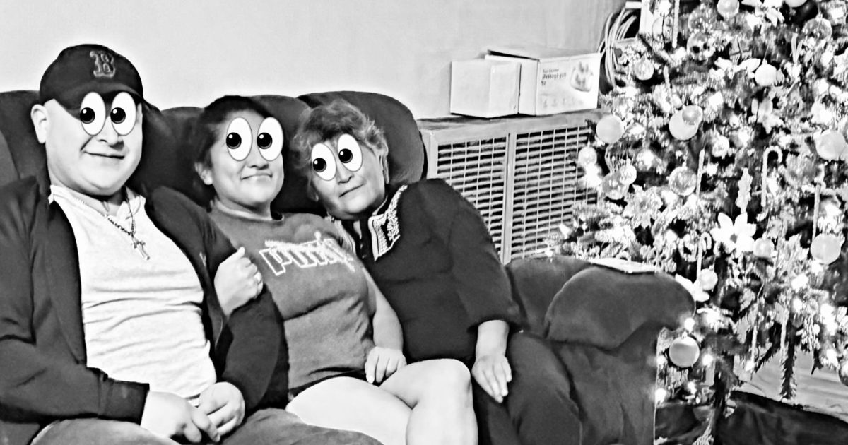 Janice Serrano sits down on the couch with her mom and little brother.