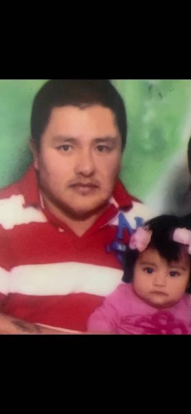 Danna and her dad pose for a photo.